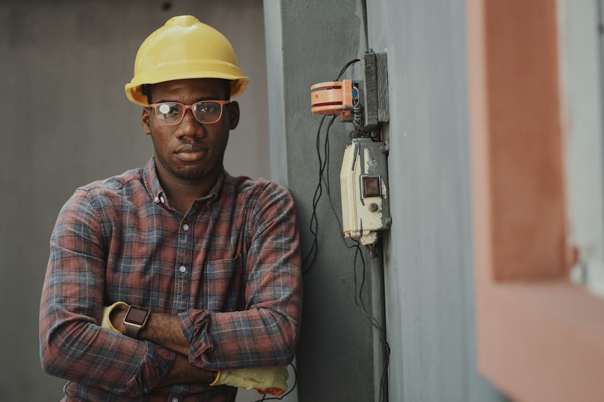 Professional installer working on a rooftop with satellite equipment